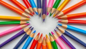 Color pencils forming a heart shape