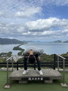 A man looking through his legs at Amanohashidate in Kyoto